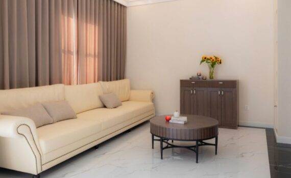 Fabric daybed sofa in a studio apartment Bangalore — styled with throw pillows and compact coffee table