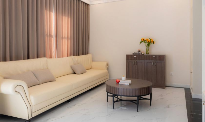 Fabric daybed sofa in a studio apartment Bangalore — styled with throw pillows and compact coffee table