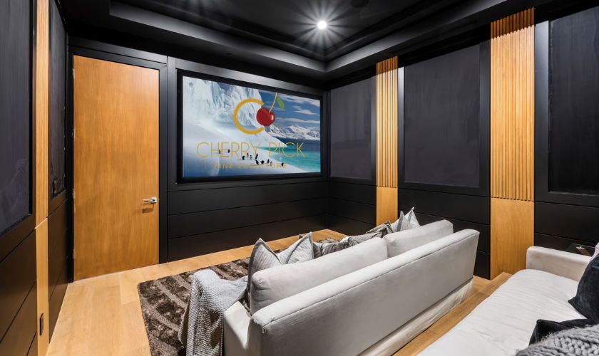 Home theatre setup Bangalore — 3-seater motorised recliner sofa with TV wall and ambient lighting in Bangalore apartment
