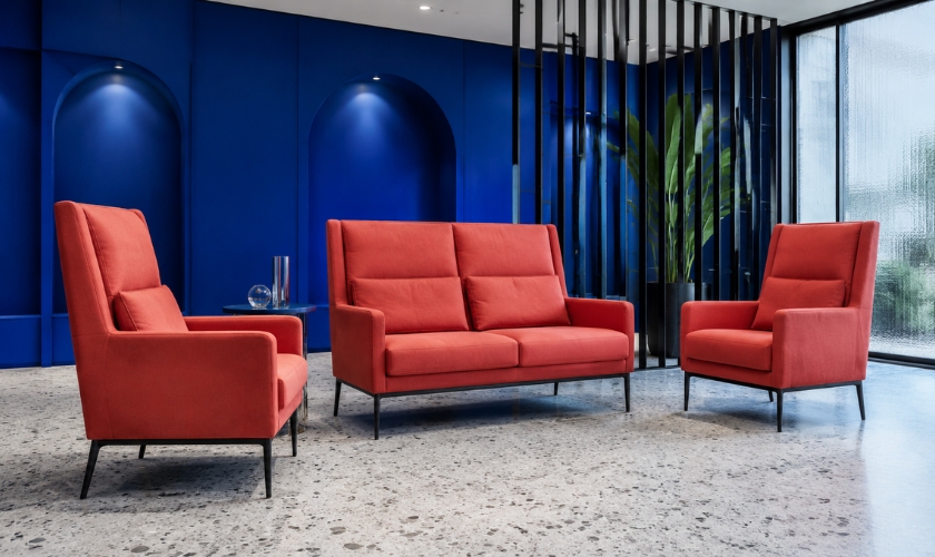 Lobby seating with firm upright cushions and arms at correct 45-48 cm seat height