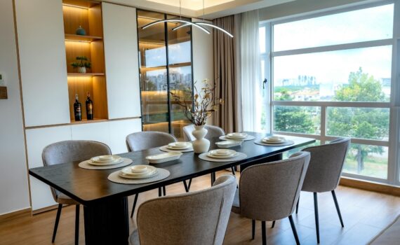 Metal dining table with marble top and slim powder-coated steel base