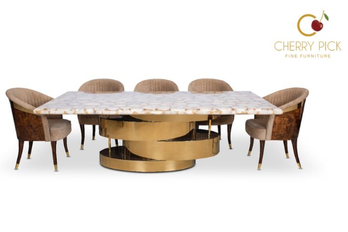Metal furniture in a contemporary dining room paired with upholstered chairs and a rug
